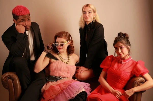 Four characters in "A Última Festa" posing together.